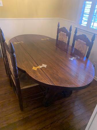 solid hardwood table with drop leaves and 4 chairs 1