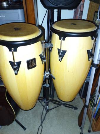Congas with stand and covers for sale, like new. 1