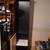 6 ft tall black lovely cabinet with glass shelves and light 1 thumbnail