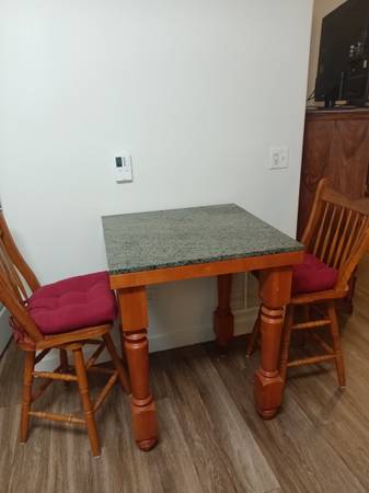 Nine Dinette set with 2 swivel wooden chairs 1