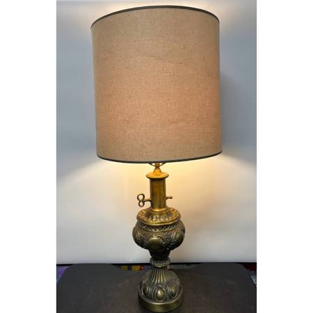 Vintage brass table lamp with a burlap style shade. Ornate base, finial key for 1