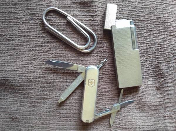 Dunhill silver lighter...Tiffany silver Swiss Army knife... Tiffany st 1