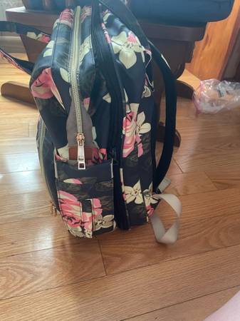 Diaper bag with built in napping basinet 1