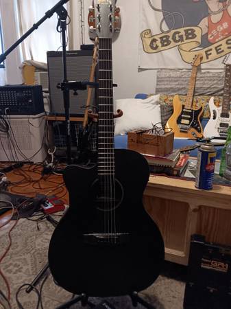 Martin x series left-handed plus free right-handed backpacker guitar 1