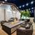 Outdoor loggia with lounge seating, heaters, and TVs 3 thumbnail