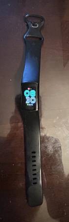 FitBit Charge 6 with charger and stand 1