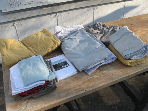 A box of bedding: sheets. pillow cases and such 1