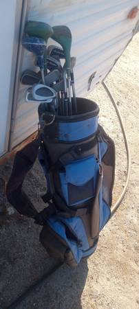 Golfing clubs and carrying bag 1