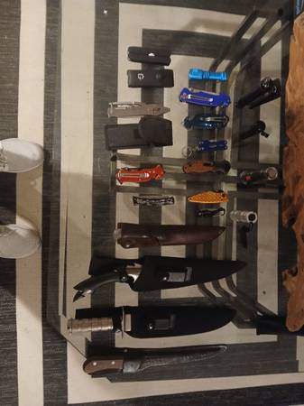 Assortment of knives flashlights and hand tools 1