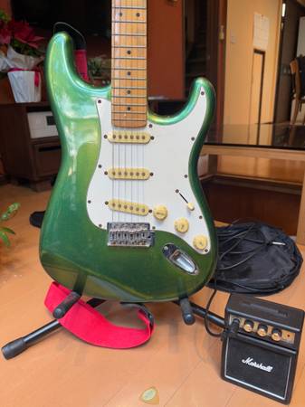 Electric guitar,stand,mini amp,strap,case 1