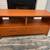 burnt orange TV / media stand with drawers and cubby shelves 1 thumbnail