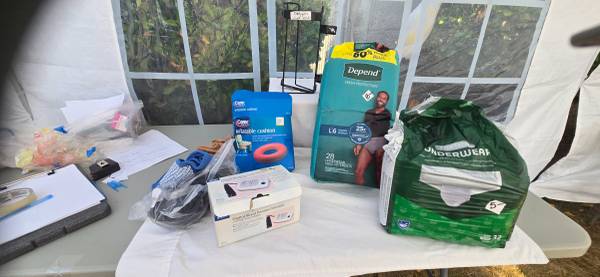 In home care stuff: pull ups, oxygen tank  holder, blood pressure 1