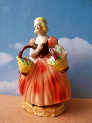 Porcelain Occupied Japan Figurine of Lady with Baskets of Flowers 1