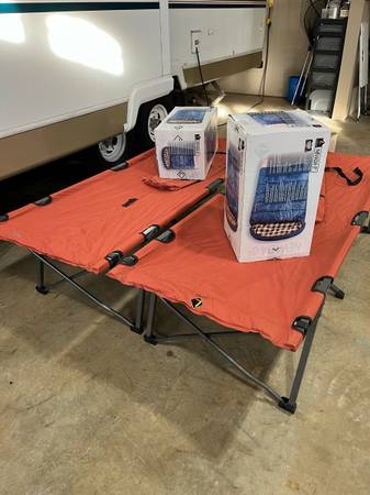 Set of two new cots and sleeping bags 1