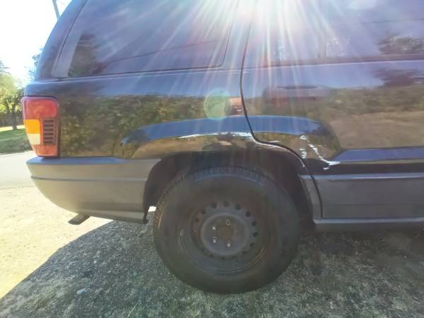 2003 Jeep Grand Cherokee negro, todo eléctrico con techo solar - $2,000 (Gig Harbor)63470766747779124