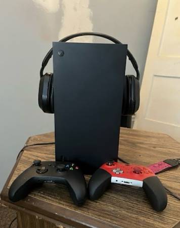 Xbox Series X with two controllers and headset 1