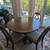 Kitchen table with upholstered chairs and leaflet 1 thumbnail