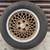 One Pontiac 16 inch rim and tire, 5 on 115mm, fits other GM cars 1 thumbnail