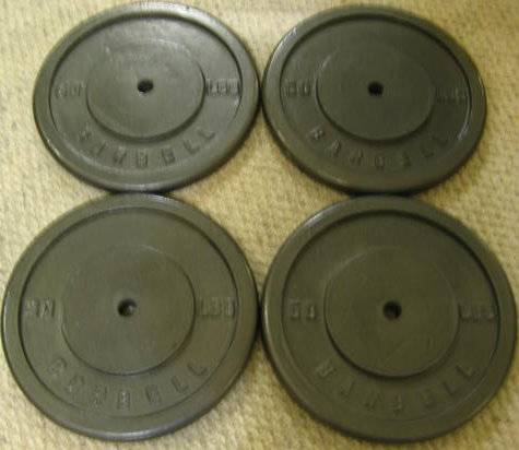 Four 50-pound Weight Plates with One Inch Holes-Exercise Equipment 1