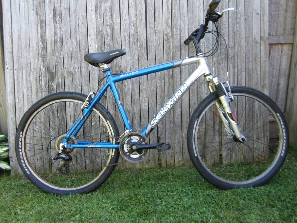 schwinn solution bicycle Traxion Mountain Bike for Adult Men Women, 29-Inch Wheels, Full Suspension, 24-Speed Shimano Drivetrain, Trigger Shifter, 18-Inch Aluminum Frame, Mechanical Disc Brake, Matte Grey/Neon Green : Sports & Outdoors while the front and rear disc brakes deliver precision stopping power Schwinn Solution GSX Women's Mountain