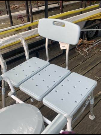 Commode and extended shower chair. 1
