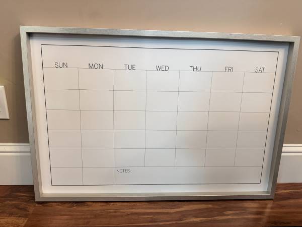 Large, framed reusable monthly dry-erase wall calendar in a brushed me 1