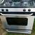 GE black and stainless gas stove $250.00 1 thumbnail