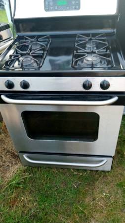 GE black and stainless gas stove $250.00 1