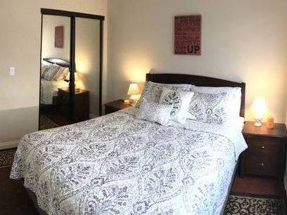 Refined 1-Bed, 1-Bath with Scroll-Print Bedding Mirrored 1