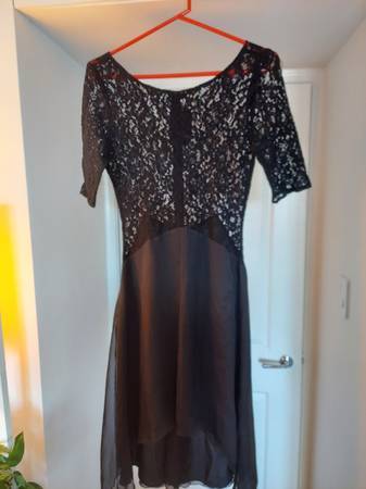 Brand new with tags,  black lace dress size small. 1