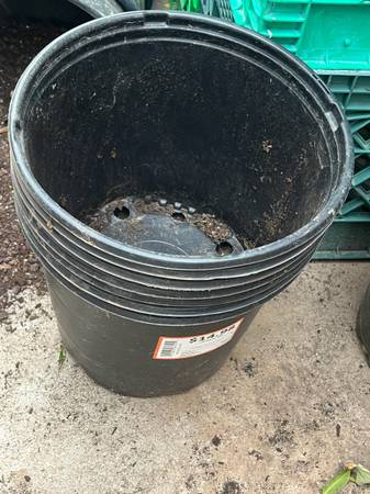Small Stack Of Plastic Planters For Gardening 1