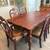 Dining room with 6 cherry-colored chairs 2 thumbnail