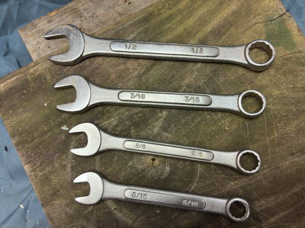 Four SAE combination wrenches 1