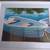 FRAMED BLUE BOAT NO.77  ON BLUE WATER PRINT-21 X 17" 1 thumbnail