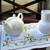 White tea pot with daisy design and a small pitcher. 2 thumbnail