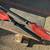 1 red kayak paddle...2 single black oars 1 thumbnail