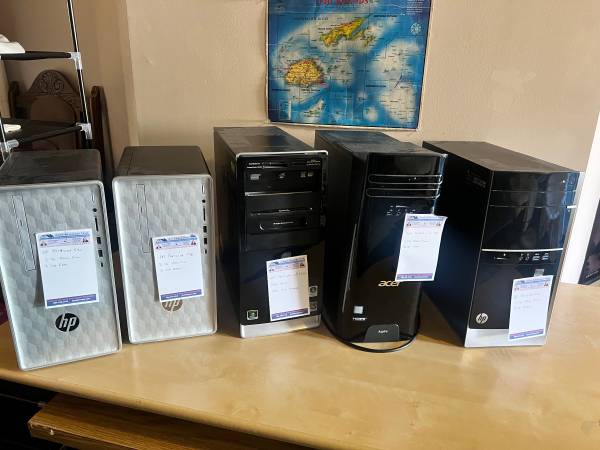 Five desktop computers including HP, Acer, and Dell 1