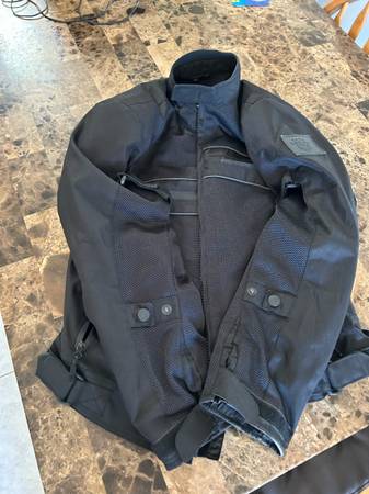 Like new mesh motorcycle jacket with collar and elbow padding. 1