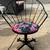 Pair of Metal Patio Swivel Chairs with Tropical Floral Cushions 5 thumbnail