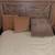 2 brown couch pillows &,1 grey wedge 3 thumbnail