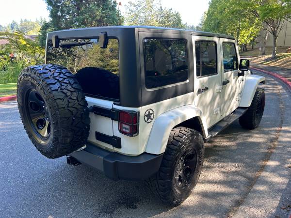 2013 Jeep Wrangler Unlimited Freedom 4WD --Título limpio, automático, elevado-- - $17,995 (kirkland)63613911642883124
