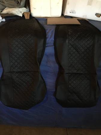 One pair of leather high back seat covers. 1