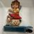 Tin Girl on Chamber Pot Toy 1 thumbnail