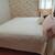 Waterbed with wooden bedframe, underbed drawers, and bedding 2 thumbnail