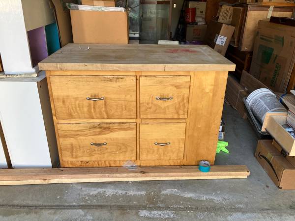 Large solid wood kitchen island with 4 drawers and bookshelves at end 1