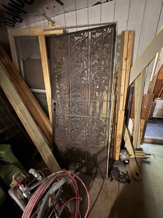 Vintage cast iron security door. Needs repair have parts 1