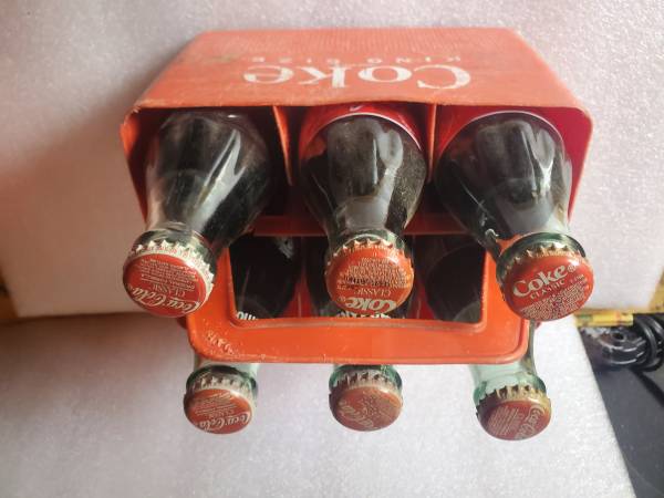 Coke bottles and plastic container 1