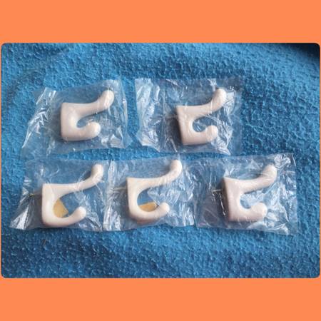 5 white ceramic hooks all for $5 1