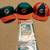 3 Miami Dolphins hats and a flag 1 thumbnail