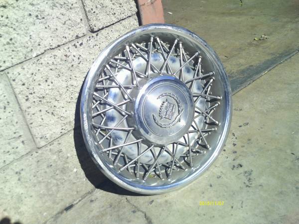 1970s and 80s cadillac wheel cover  (phone call please) 1